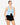 Model wearing powder blue halter neck open-back top with buckle detail, styled for a bold, chic look, studio background