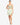 Model wearing sage sleeveless bustier tank top with sweetheart neckline and seam detailing, styled for a modern, structured look, studio background