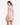 Model wearing pink waffle knit bell sleeve top and skirt set, styled for a casual yet chic look, studio background